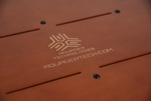 Laser-engraved Aquager Technologies logo on sustainable wooden hydroponic farm panel.