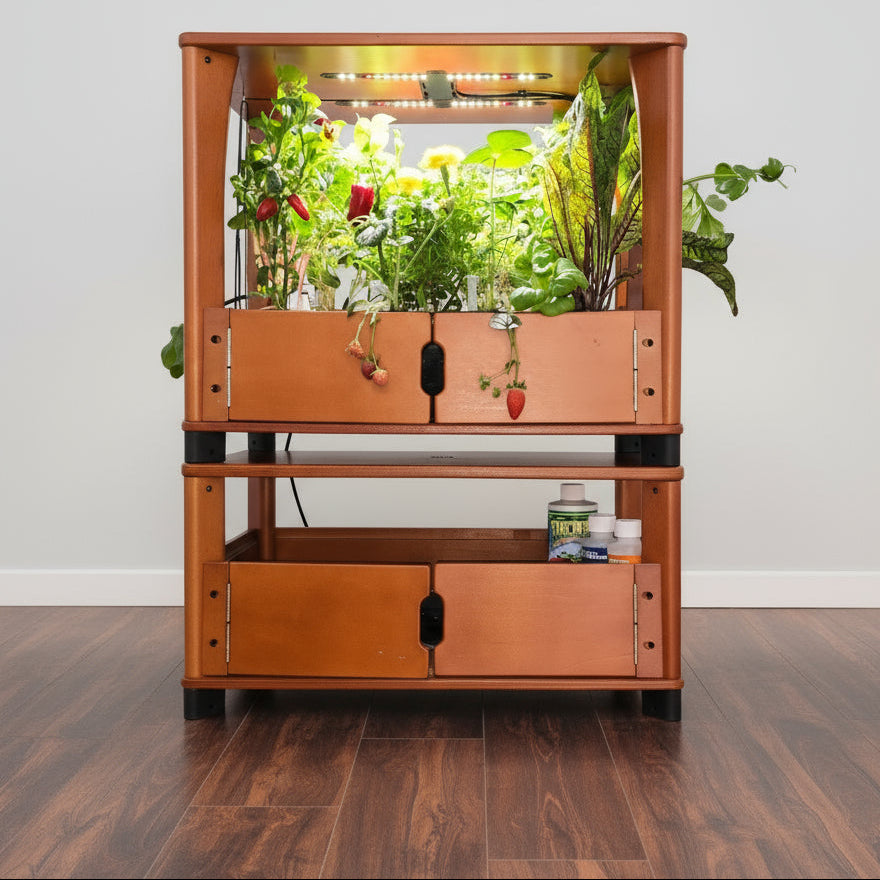 Wooden indoor garden with plants and LED lights on a wooden floor.