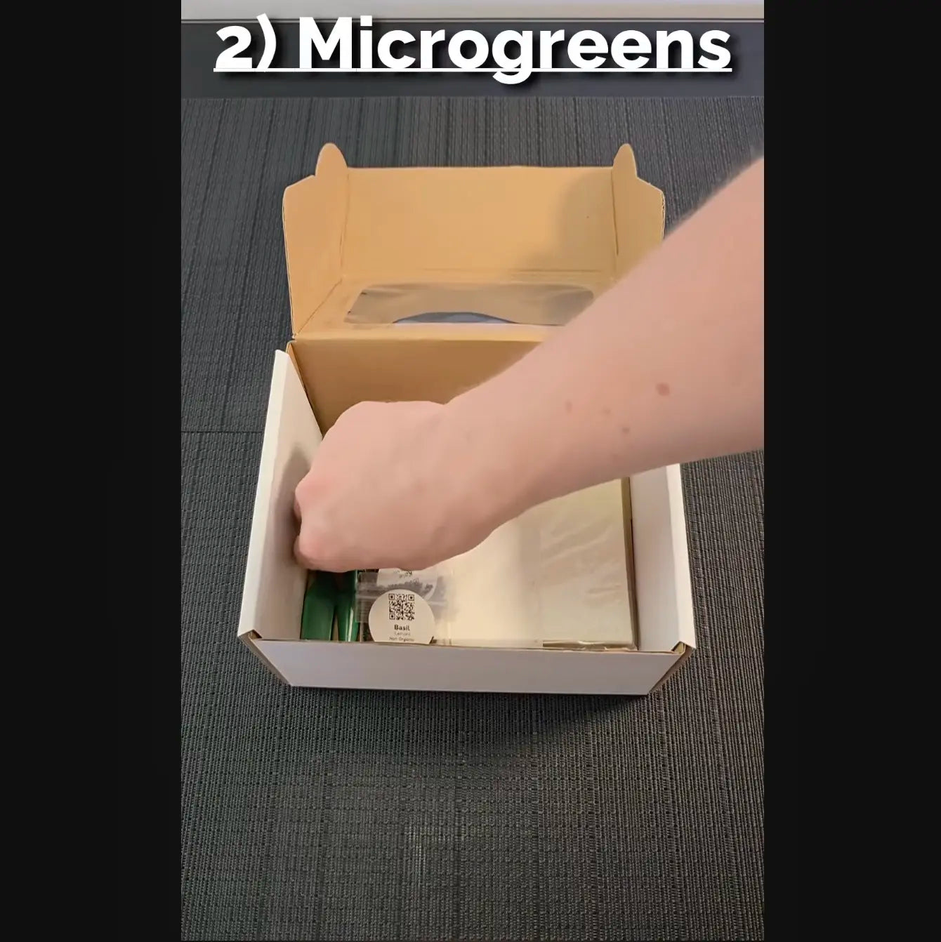 Screen capture of a tutorial on setting up an indoor garden kit, showing water being added to a container.