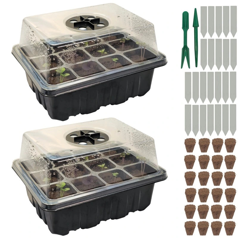 Two seedling trays with clear covers, small plants, plant labels, and small pots on a white background.