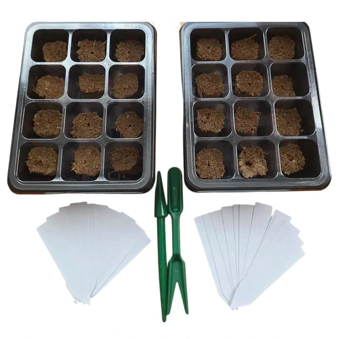 Two seedling trays with soil, two green trowels, and white labels on a white background