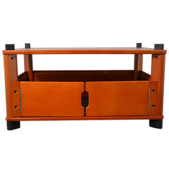 Wooden TV stand with a single drawer on a white background